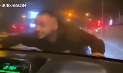 Bursa'da Arkadaşını Kaputa Çıkararak Tehlikeye Atan Sürücü