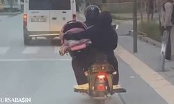 Bursa'da Motosiklet Sürücüsü Bebeği Pusette Taşıdı