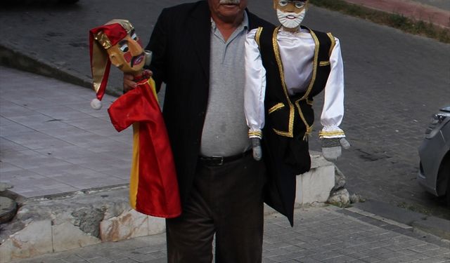 Kadiri amcadan simit tezgahında çocuklara gölge oyunu